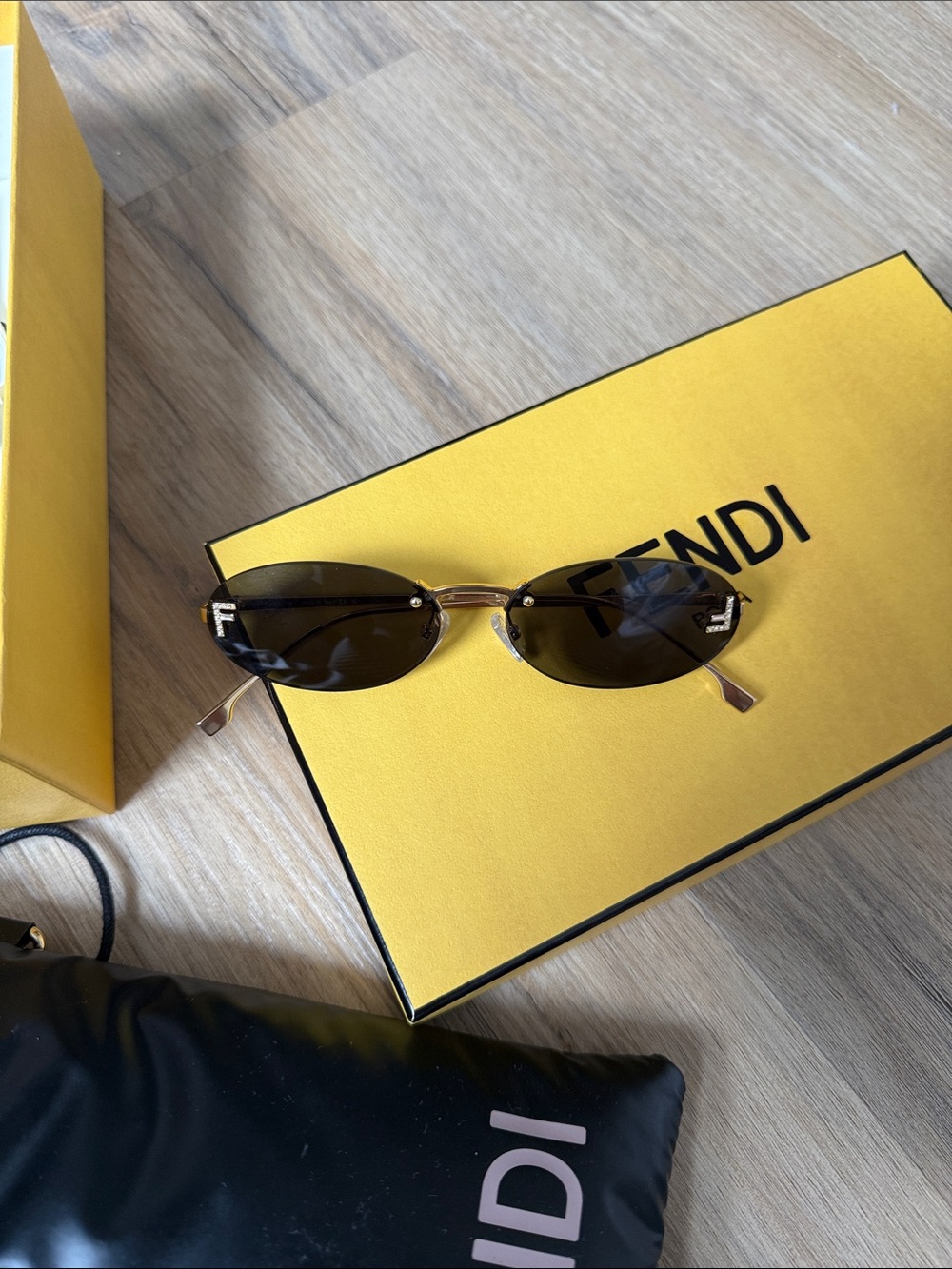 Fendi Slim Oval Sunglasses in Dark Brown and Gold